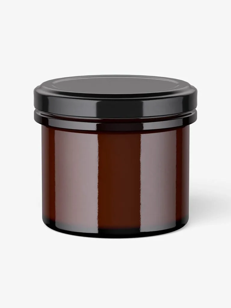 A short dark brown glass candle jar with a broad black lid.