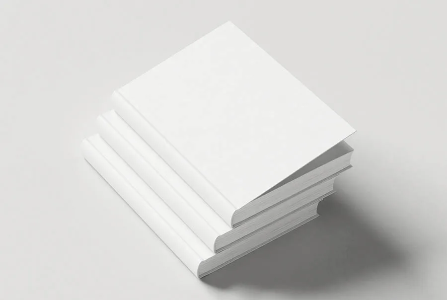 Stack of blank white hardcover books viewed from above at an angle on a pale gray background.