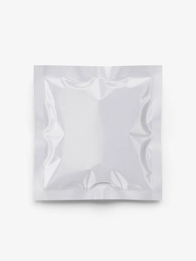 A blank square sachet with reflective creases and sealed edges.