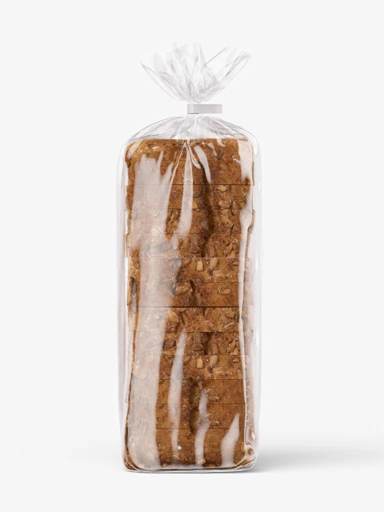 Sliced bread standing inside a clear bag with a gathered top.